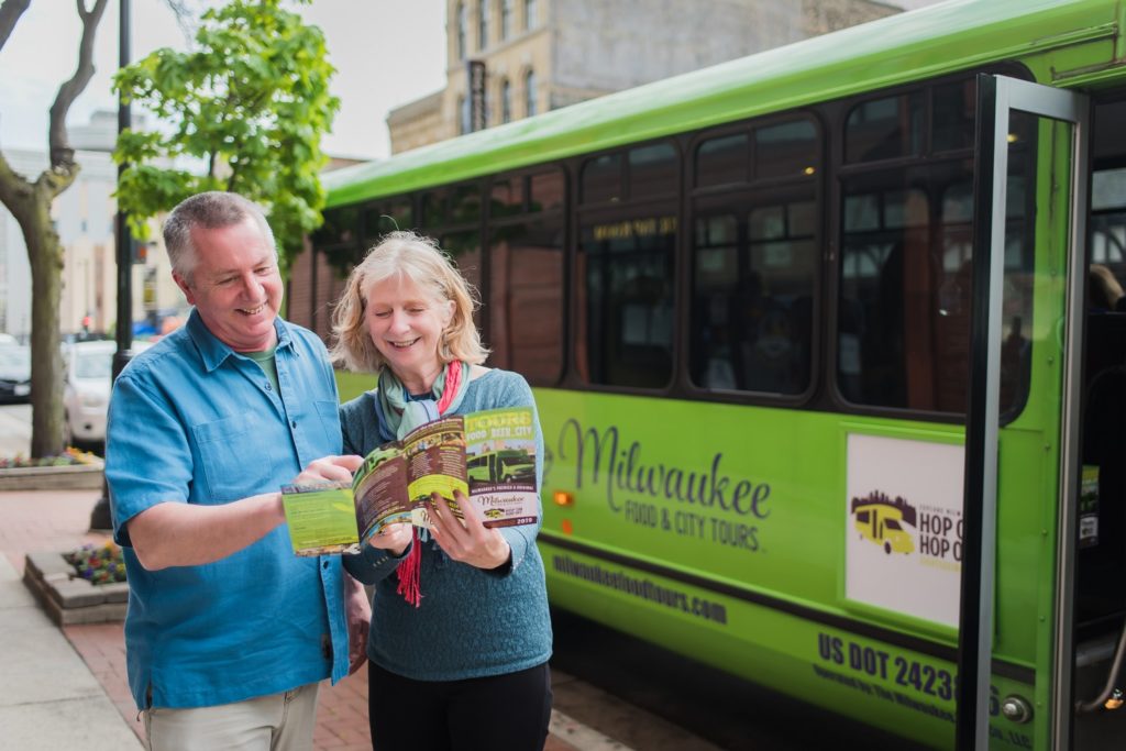 tourists looking at a map of downtown Milwaukee